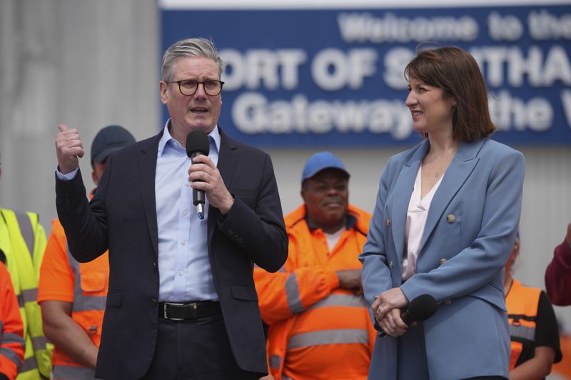 Britain's Labour Party leader Keir Starmer with shadow chancellor Rachel Reeves speaks during a general election campaign event Southampton Docks in Southampton, England, Monday, June 17, 2024. (AP Photo/Kin Cheung)