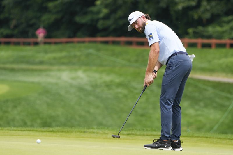 Cameron Young lines up a putts on the 12th green during the third round of the Travelers Championship golf tournament at TPC River Highlands, Saturday, June 22, 2024, in Cromwell, Conn. (AP Photo/Seth Wenig)