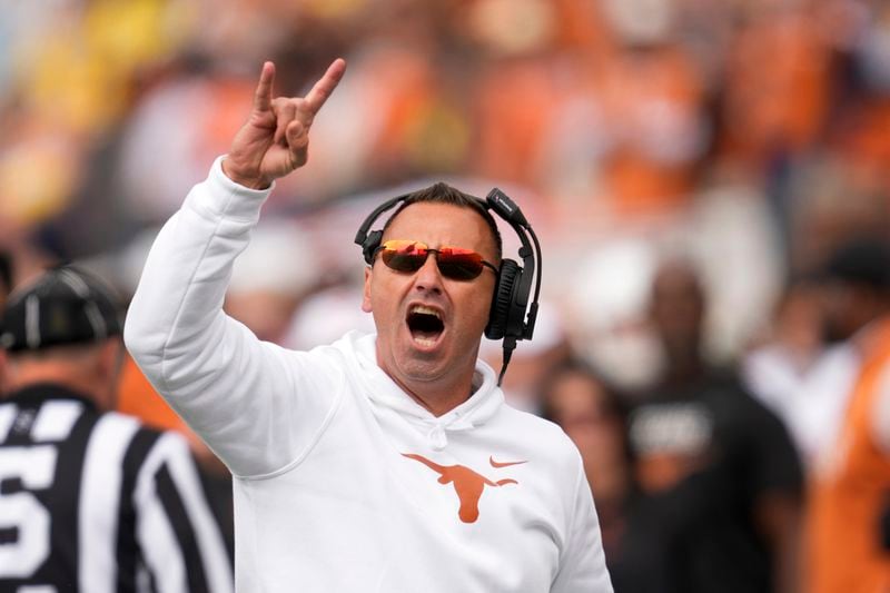 Texas head coach Steve Sarkisian reacts to fans in the second half of an NCAA college football game against Michigan in Ann Arbor, Mich., Saturday, Sept. 7, 2024. (AP Photo/Paul Sancya)