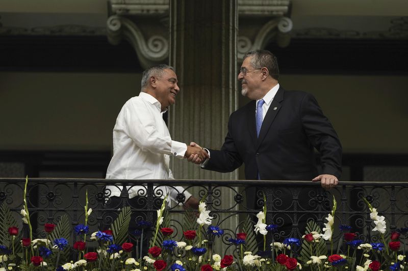 FILE - Guatemalan President Bernardo Arevalo, right, shakes hands with Belize's Prime Minister Johnny Briceno at the National Palace during Briceno's visit to Guatemala City, Monday, Aug. 26, 2024. (AP Photo/Moises Castillo, File)