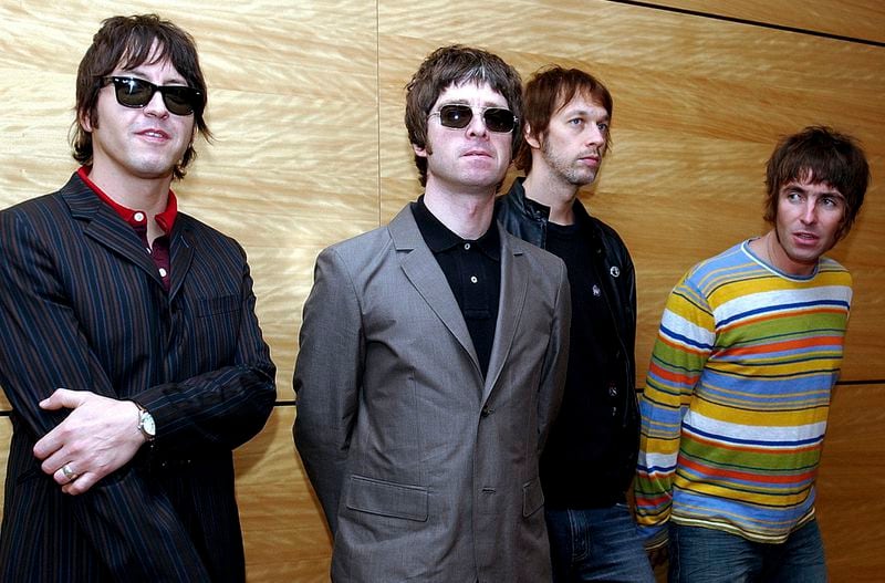 FILE - Members of British rock band Oasis pose for photos ahead of a concert in Hong Kong, Feb. 25, 2006. From left are, Gem Archer, Noel Gallagher, Andy Bell, and Liam Gallagher. (AP Photo/Lo Sai Hung)