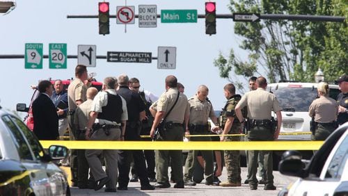 Forsyth County sheriff’s deputies work an accident/crime scene. County residents have an upgraded way to get information on such crime cases, now that a new sheriff’s website has gone live. AJC file photo