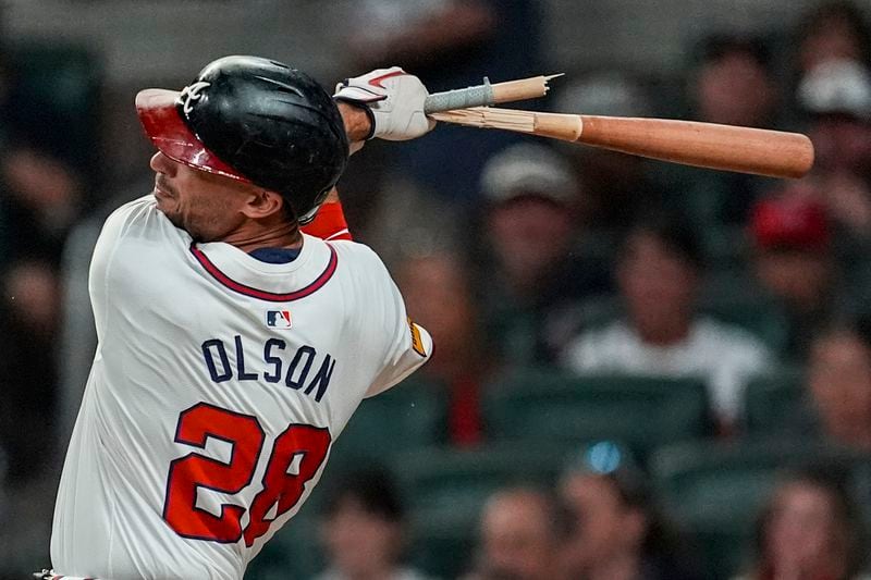 Atlanta Braves first baseman Matt Olson (28) breaks a bat on a single against the Philadelphia Phillies during the eighth inning of a baseball game, Tuesday, Aug. 20, 2024, in Atlanta. (AP Photo/Mike Stewart)