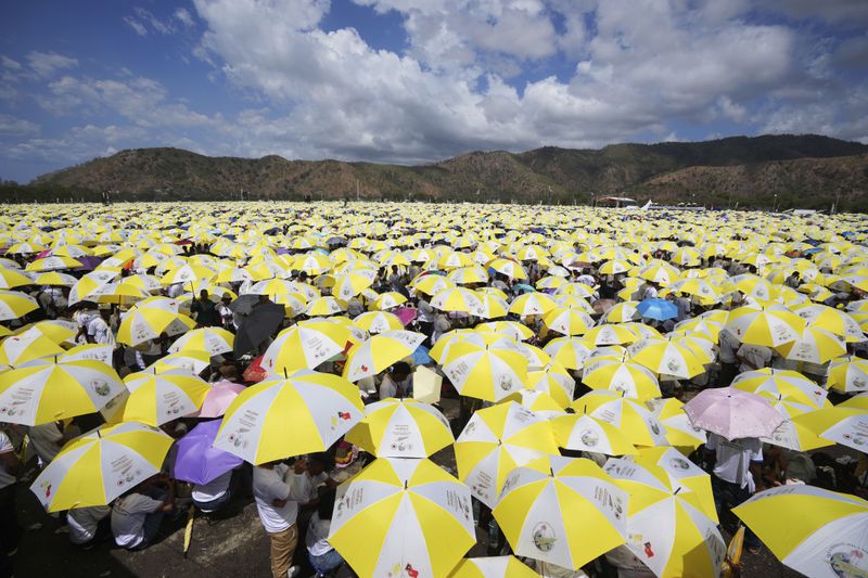 East Timorese crowd Tacitolu park for Pope Francis' Mass in Dili, East Timor, Tuesday, Sept. 10, 2024. (AP Photo/Firdia Lisnawati)