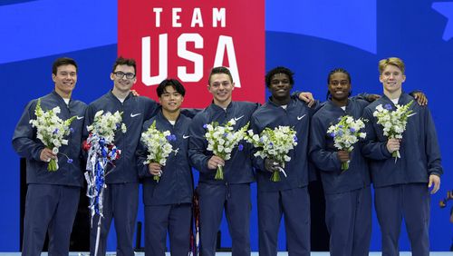 From left to right, Brody Malone, Stephen Nedoroscik, Asher Hong, Paul Juda, Frederick Richard, Khoi Young and Shane Wiskus celebrate after being named to the 2024 Olympic team at the United States Gymnastics Olympic Trials on Saturday, June 29, 2024, in Minneapolis. (AP Photo/Charlie Riedel)