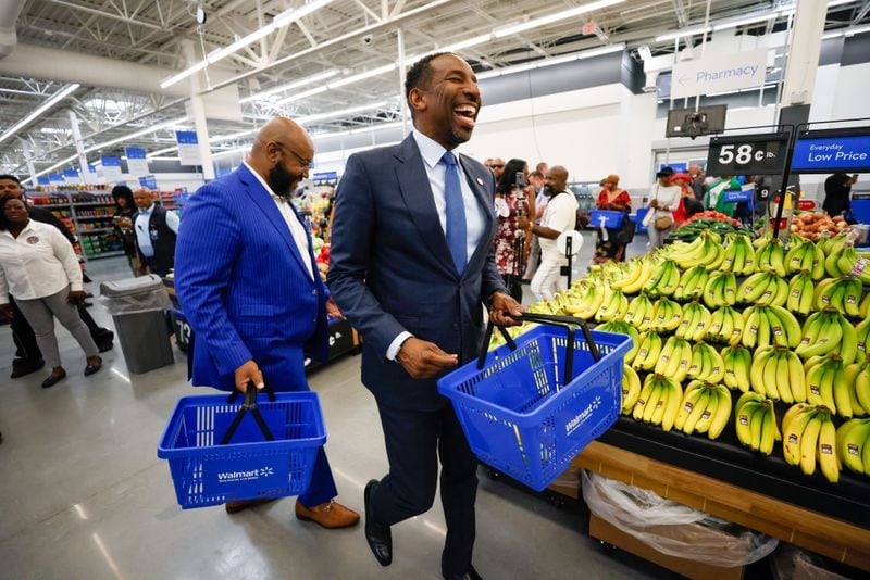 Atlanta Mayor Andre Dickens (right) was on hand for the opening of the Walmart Neighborhood Market in Vine City on Wednesday.