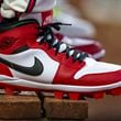 FILE - Atlanta Braves outfielder Jorge Soler wears custom Nike Air Jordan cleats in the dugout during the seventh inning of a baseball game against the Colorado Rockies, Sept. 5, 2024, in Atlanta. (AP Photo/Jason Allen, File)