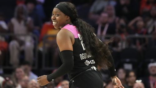 Arike Ogunbowale, of Team WNBA, smiles after hitting a 3-pointer against Team USA during the second half of a WNBA All-Star basketball game Saturday, July 20, 2024, in Phoenix. (AP Photo/Ross D. Franklin)