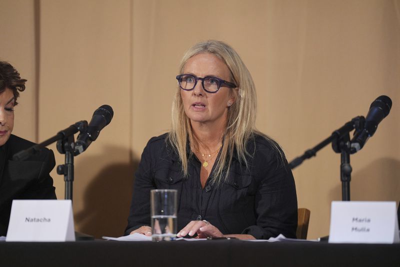 One of Mr Al Fayed's accusers, Natacha (no surname given), who featured in 'Al-Fayed: Predator at Harrods' speaks during a press conference to discuss their involvement in the investigation and the legal claim against Harrods for failing to provide a safe system of work for their employees, at Kent House in Knightsbridge, London, Friday Sept. 20, 2024. Multiple ex-Harrods employees have accused Mohamed Al Fayed, the Egyptian billionaire who owned the luxury department store for more than 25 years, of rape and sexual assault. (Yui Mok/PA via AP)