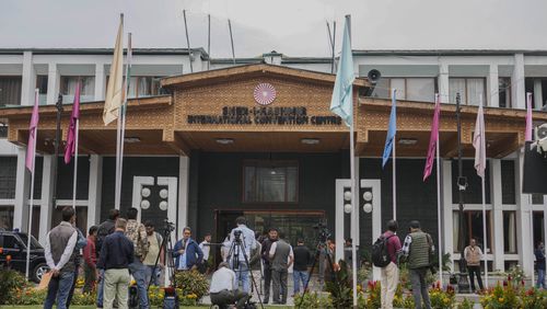 Media persons wait outside a vote counting center the recent election on the outskirts of Srinagar, Indian controlled Kashmir, Tuesday, Oct. 8, 2024. (AP Photo/Mukhtar Khan)