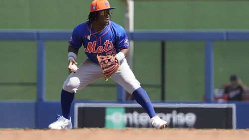 New York Mets second baseman Luisangel Acuna throws to first during the second inning of a spring training baseball game against the Washington Nationals Monday, Feb. 26, 2024, in West Palm Beach, Fla. (AP Photo/Jeff Roberson)