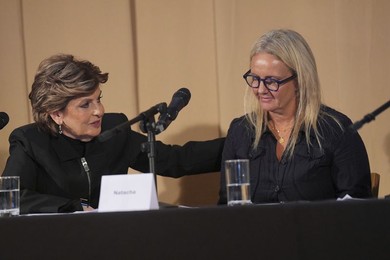 One of Mr Al Fayed's accusers, Natacha (right), no surname given, who featured in 'Al-Fayed: Predator at Harrods' is reassured by American Attorney Gloria Allred after speaking during a press conference to discuss her involvement in the investigation and the legal claim against Harrods for failing to provide a safe system of work for their employees, at Kent House in Knightsbridge, London, Friday Sept. 20, 2024. (Yui Mok/PA via AP)