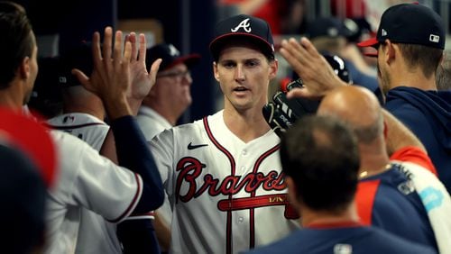 Braves starting pitcher Kyle Wright greets teammates after completing the top of the sixth inning against the Marlins on Friday night at Truist Park. Wright pitched six scoreless innings with 11 strikeouts. (Jason Getz / Jason.Getz@ajc.com)