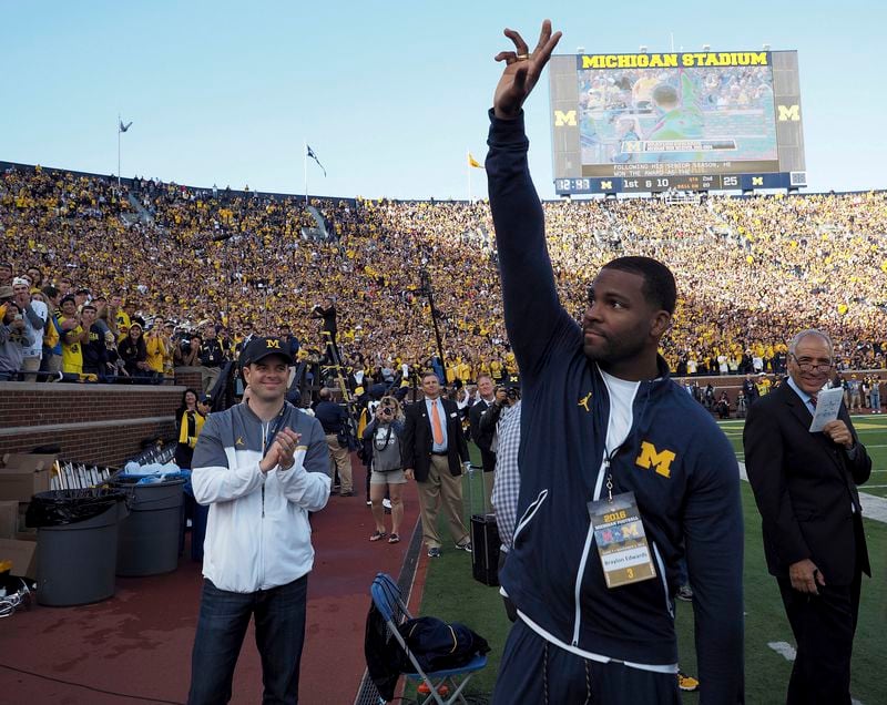 FILE - Former Michigan wide receiver Braylon Edwards is recognized by the stadium announcer to the crowd in the second quarter of an NCAA college football game against Maryland in Ann Arbor, Mich., Saturday, Nov. 5, 2016. (AP Photo/Tony Ding, File)