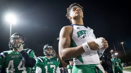 Harrison quarterback Justin Fields holds ice on his hand as he watches from the sideline after coming out of the football game against Dalton during the second half on Thursday, Oct. 19, 2017, in Kennesaw, Ga. (Special to the Atlanta Journal-Constitution, John Amis )