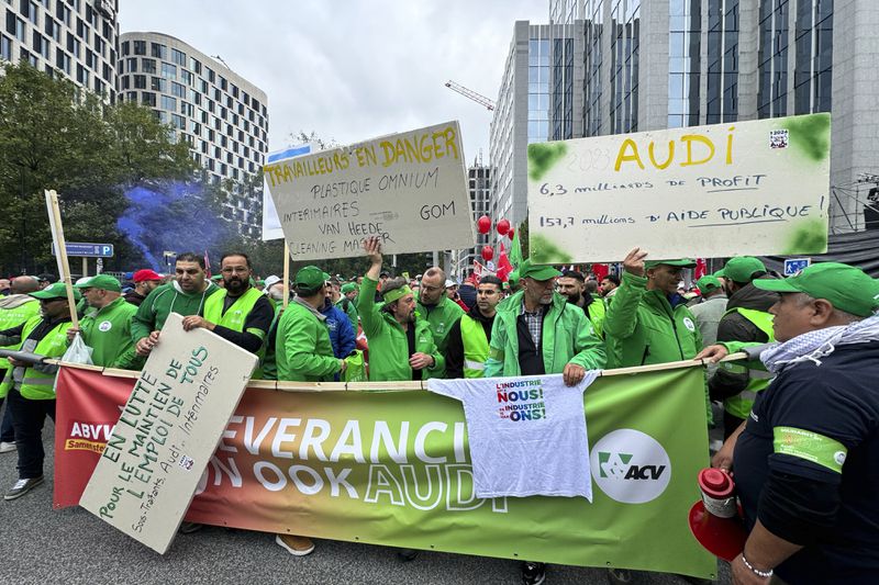 Workers of the German automaker Audi protest the threat of massive layoffs in downtown Brussels, Belgium, Monday Sept. 16, 2024. (AP Photo/Sylvain Plazy)