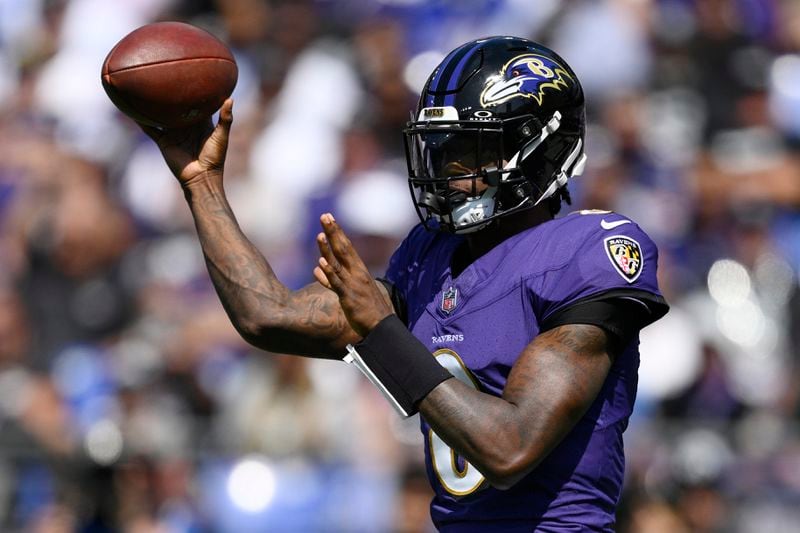 Baltimore Ravens quarterback Lamar Jackson (8) throws against the Las Vegas Raiders during the first half of an NFL football game, Sunday, Sept. 15, 2024, in Baltimore. (AP Photo/Nick Wass)