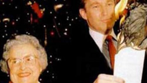 Donald Trump and Annabel Hill of Georgia in 1986. They are burning her farm mortage after she received help for Trump.