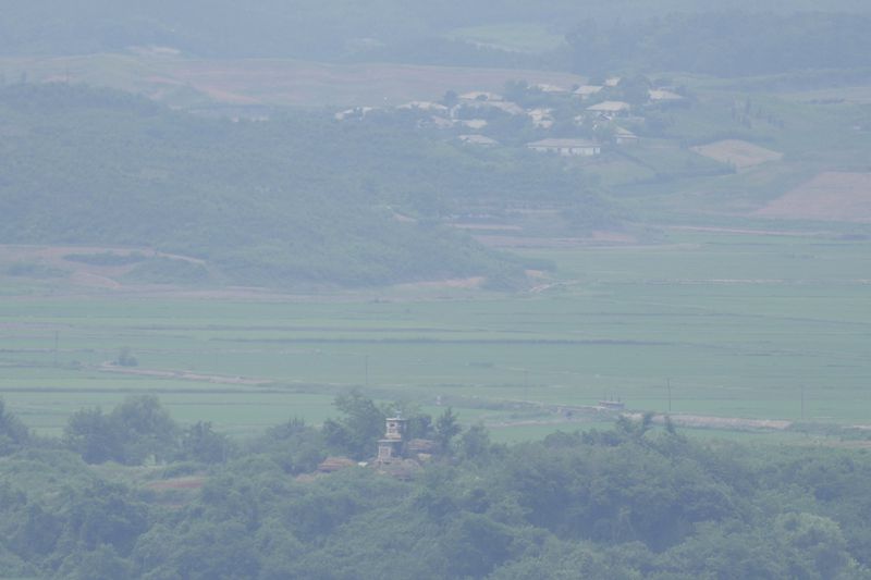 North Korea's military guard post is seen from the unification observatory in Paju, South Korea, Friday, June 21, 2024. South Korea summoned the Russian ambassador to protest the country's new defense pact with North Korea on Friday, as border tensions continued to rise with vague threats and brief, seemingly accidental incursions by North Korean troops. (AP Photo/Lee Jin-man)