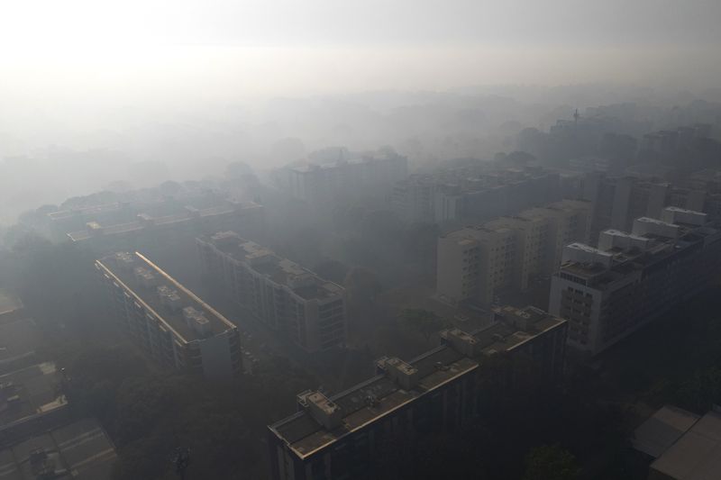 Smoke from fire in the environmentally protected area of Brasilia National Park affects Brasilia, Brazil, Monday, Sept. 16, 2024. The head of the agency that manages protected areas, Mauro Pires, told the local press that the fire is man-made and appears to have started near the edge of a farm. (AP Photo/Eraldo Peres)