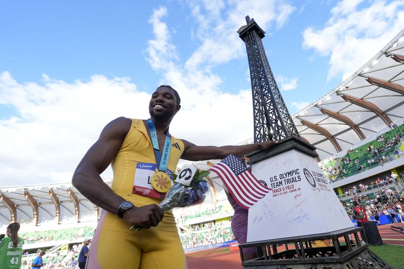 Noah Lyles celebrates after winning the men's 200-meter final during the U.S. Track and Field Olympic Team Trials Saturday, June 29, 2024, in Eugene, Ore. (AP Photo/George Walker IV)