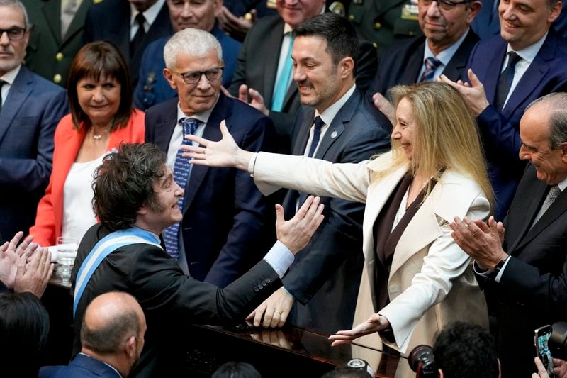 Argentina's President Javier Milei greets his sister Karina Milei as he arrives to Congress to present the 2025 budget in Buenos Aires, Argentina, Sunday, Sept. 15, 2024. (AP Photo/Natacha Pisarenko)