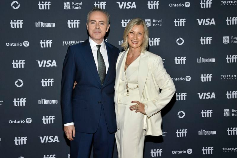 John Crowley, left, and Fiona Weir attend the premiere of "We Live in Time" at Princess of Wales Theatre during the Toronto International Film Festival on Friday, Sept. 6, 2024, in Toronto. (Photo by Evan Agostini/Invision/AP)