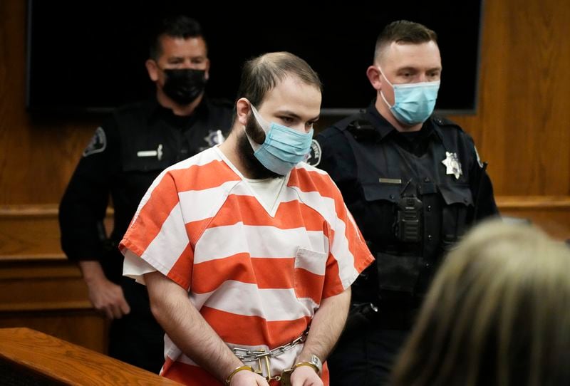 FILE - Ahmad Al Aliwi Alissa, who is accused of killing 10 people at a Colorado supermarket in March 2021, is led into a courtroom in Boulder, Colorado, for a hearing on Sept. 7, 2021. (AP Photo/David Zalubowski, Pool, File)