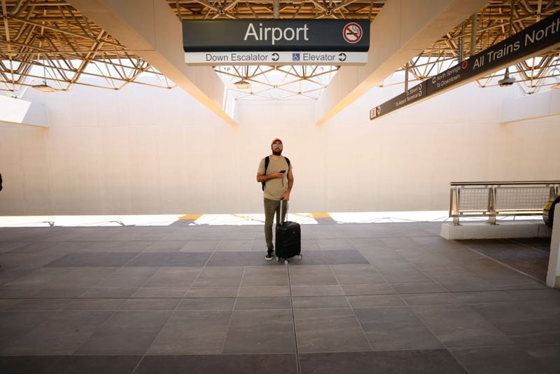 A traveler stands at the newly renovated MARTA Airport Station, which opened to the public on Monday, May 20, 2024. The renovation, which took about six weeks, included new flooring, replacing ceilings and lighting, and installing infrastructure for a new elevator.
(Miguel Martinez / AJC)