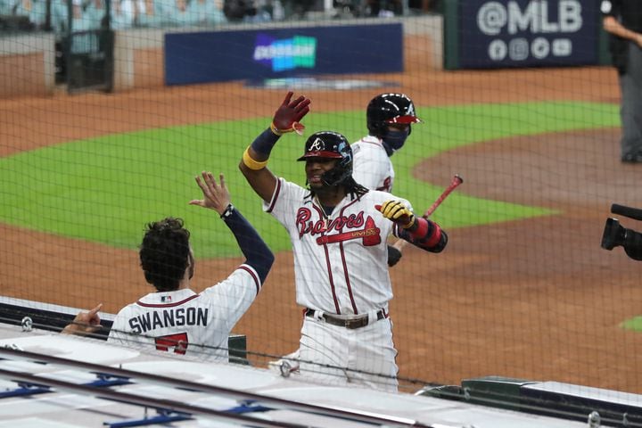 Braves' Ronald Acuna reacts to hitting a solo home run for a 1-0 lead in the first inning of Game 1 of the National League Division Series against the Miami Marlins Tuesday, Oct. 6, 2020, at Minute Maid Park in Houston. (Curtis Compton / Curtis.Compton@ajc.com)