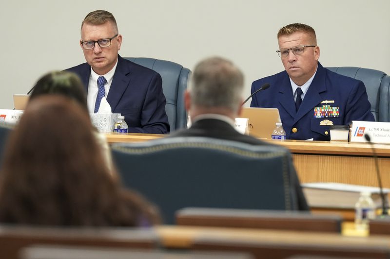 Jason Neubauer, board chairman, left, and Thomas Whalen, board member, right, listen during the Titan marine board formal hearing inside the Charleston County Council Chambers, Thursday, Sept. 19, 2024, in North Charleston, S.C. (Corey Connor via AP, Pool)