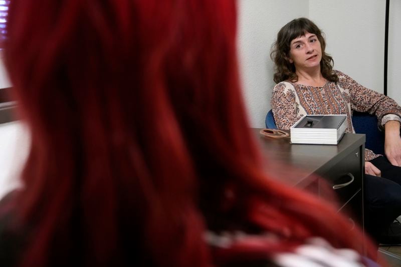 Methadone patient Irene Garnett, 44, of Phoenix, meets with counselor Melodie Reece at a clinic in Scottsdale, Ariz., on Monday, Aug. 26, 2024. (AP Photo/Ross D. Franklin)