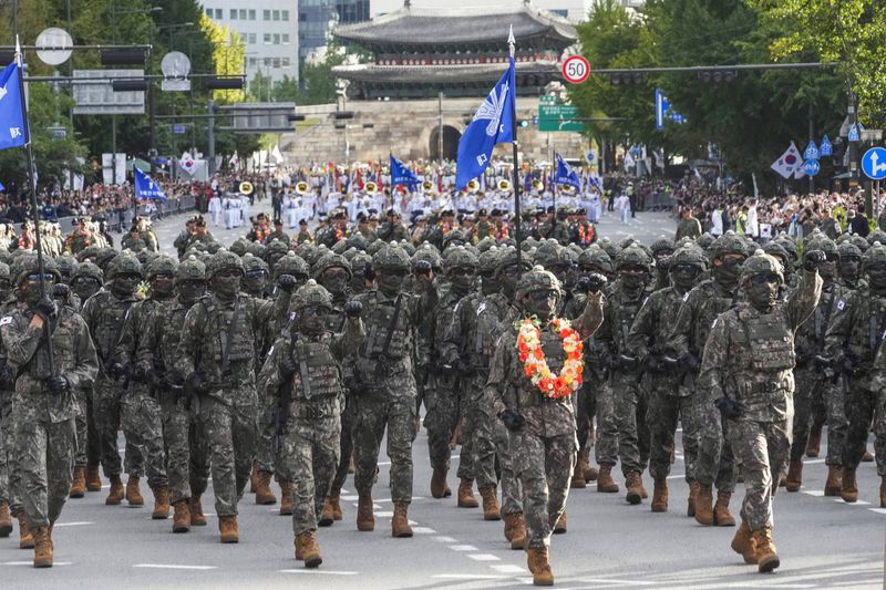 South Korean army soldiers take part in a parade during the 76th Armed Forces Day ceremony in Seoul, South Korea, Tuesday, Oct. 1, 2024. (AP Photo/Ahn Young-joon)