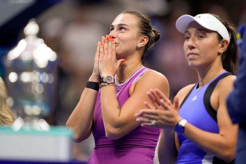 Aryna Sabalenka, of Belarus, left, and Jessica Pegula, of the United States, wait for the start of the trophy ceremony after Sabalenka defeated Pegula in the women's singles final of the U.S. Open tennis championships, Saturday, Sept. 7, 2024, in New York. (AP Photo/Julia Nikhinson)