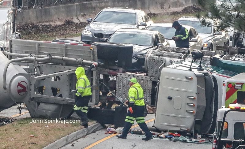 A tractor-trailer overturned on the East-West Connector in Cobb County.