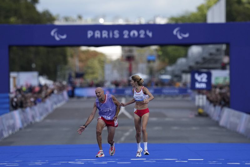 Spain's Elena Congosto, right, wins the bronze medal in the women's marathon T12 at the 2024 Paralympic Games in Paris, France, Sunday, Sept. 8, 2024. (Photo by The Associated Press/Thibault Camus)