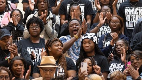 Black Voters Matter activists applaud at a press conference at the Capitol in Atlanta on Wednesday, February 28, 2024. (Arvin Temkar / arvin.temkar@ajc.com)