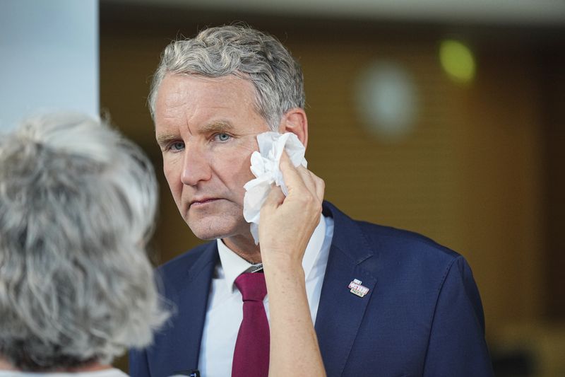 Bjoern Hoecke, top candidate in Thuringia of the far-right Alternative for Germany, prepares for an interview during the state election for Thuringia, in Erfurt, Germany, Sunday, Sept. 1, 2024. (Michael Kappeler/dpa via AP)