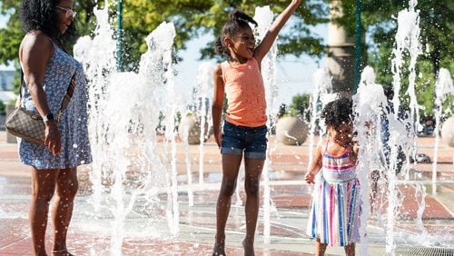 Children play in the fountains on June 24 at Centennial Olympic Park in Atlanta. (Seeger Gray/The Atlanta Journal-Constitution)