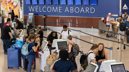 Travelers line up to check in to Delta flights at Hartsfield-Jackson airport in Atlanta on Monday, July 8, 2024. (Arvin Temkar / AJC)