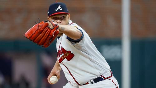 Atlanta Braves relief pitcher Joe Jimenez (77) delivers to the Philadelphia Phillies during the sixth inning of NLDS Game 2 in Atlanta on Monday, Oct. 9, 2023.   (Miguel Martinez / Miguel.Martinezjimenez@ajc.com)