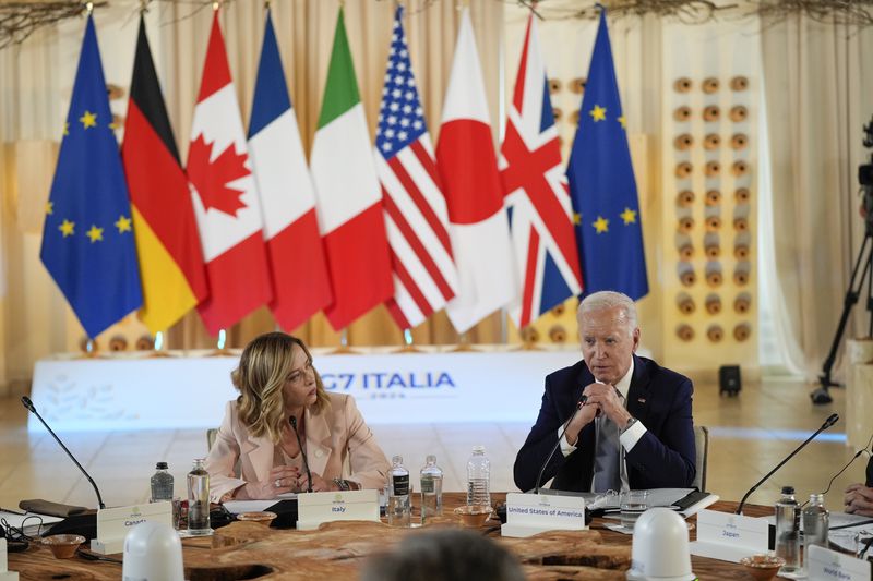 President Joe Biden and Italian Prime Minister Giorgia Meloni, left, attend the Partnership for global infrastructure and investment event at the G7 summit, Thursday, June 13, 2024, in Borgo Egnazia, Italy. (AP Photo/Alex Brandon)