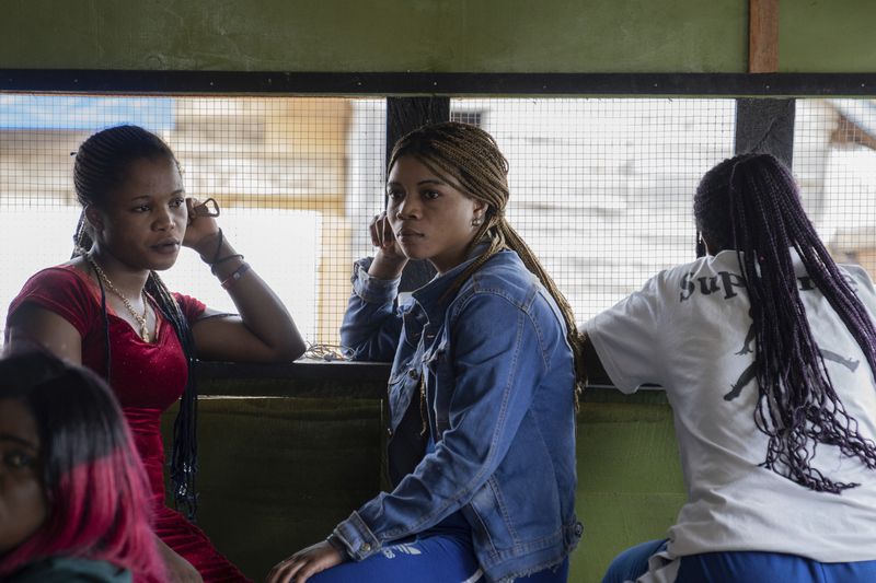 Sex workers listen to a briefing on mpox Wednesday, Sept. 4, 2024 in a bar in Kamituga, eastern Congo. (AP Photo/Moses Sawasawa)