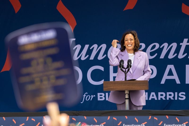 Vice President Kamala Harris speaks at a Juneteenth Block Party campaign event outside her new campaign headquarters in Atlanta on Tuesday, June 18, 2024. (Arvin Temkar / AJC)