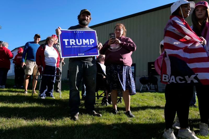 Jeff Norton, of Monroe, Wis., waits to enter a Republican presidential nominee former President Donald Trump campaign event at Dane Manufacturing, Tuesday, Oct. 1, 2024, in Waunakee, Wis. (AP Photo/Charlie Neibergall)