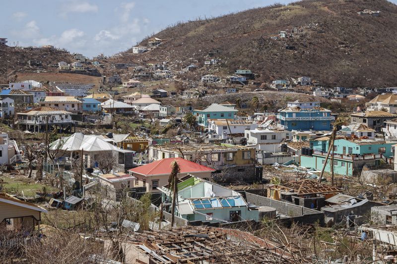 Homes destroyed by Hurricane Beryl lie in Clifton, Union Island, St. Vincent and the Grenadines, Thursday, July 4, 2024. (AP Photo/Lucanus Ollivierre)