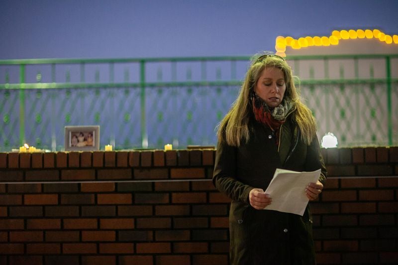 Jeanie Waddell speaks about her sister, Terri Waddell, during a vigil Thursday night in Marietta.