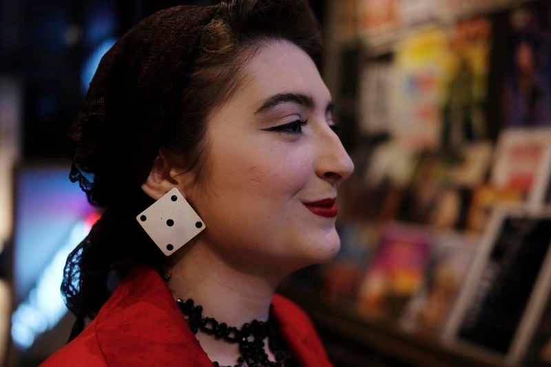 Greer Elise Barajas stands for a portrait at the Ryman Auditorium gift shop before attending a concert by the band Postmodern Jukebox in Nashville, Tenn., on July 30, 2024. (AP Photo/Luis Andres Henao)