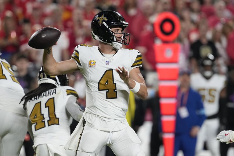 New Orleans Saints quarterback Derek Carr throws during the first half of an NFL football game against the Kansas City Chiefs Monday, Oct. 7, 2024, in Kansas City, Mo. (AP Photo/Ed Zurga)