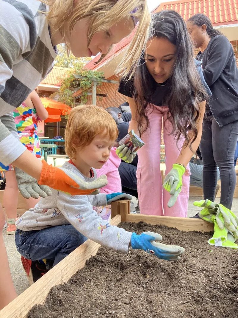 First-grade students at Virginia-Highland Elementary School plant carrot seeds in their new learning garden. (Photo Courtesy of Dyana Bagby)